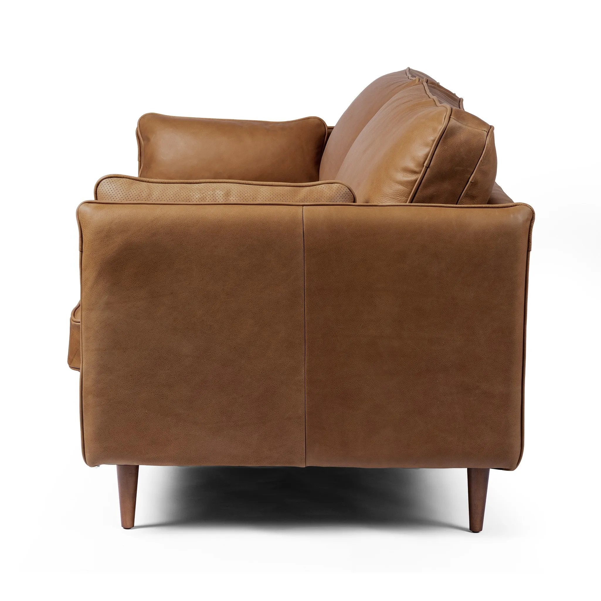 Featuring Reese Palermo Cognac Sofa by Four Hands at Amethyst Home. Effortlessly on-trend. Two-cushion seating of top-grain leather, with knife-edge pillows and welted track arms. Almond-finished legs taper for a modern touch atop midcentury influence.Overall Dimensions: 76.00"w x 35.00"d x 32.75"hWeight : 110.89 lbsMaterials: Top Grain Leather, Poplar Plywo. Amethyst Home provides interior design, new home construction design consulting, vintage area rugs, and lighting in the Monterey metro area.