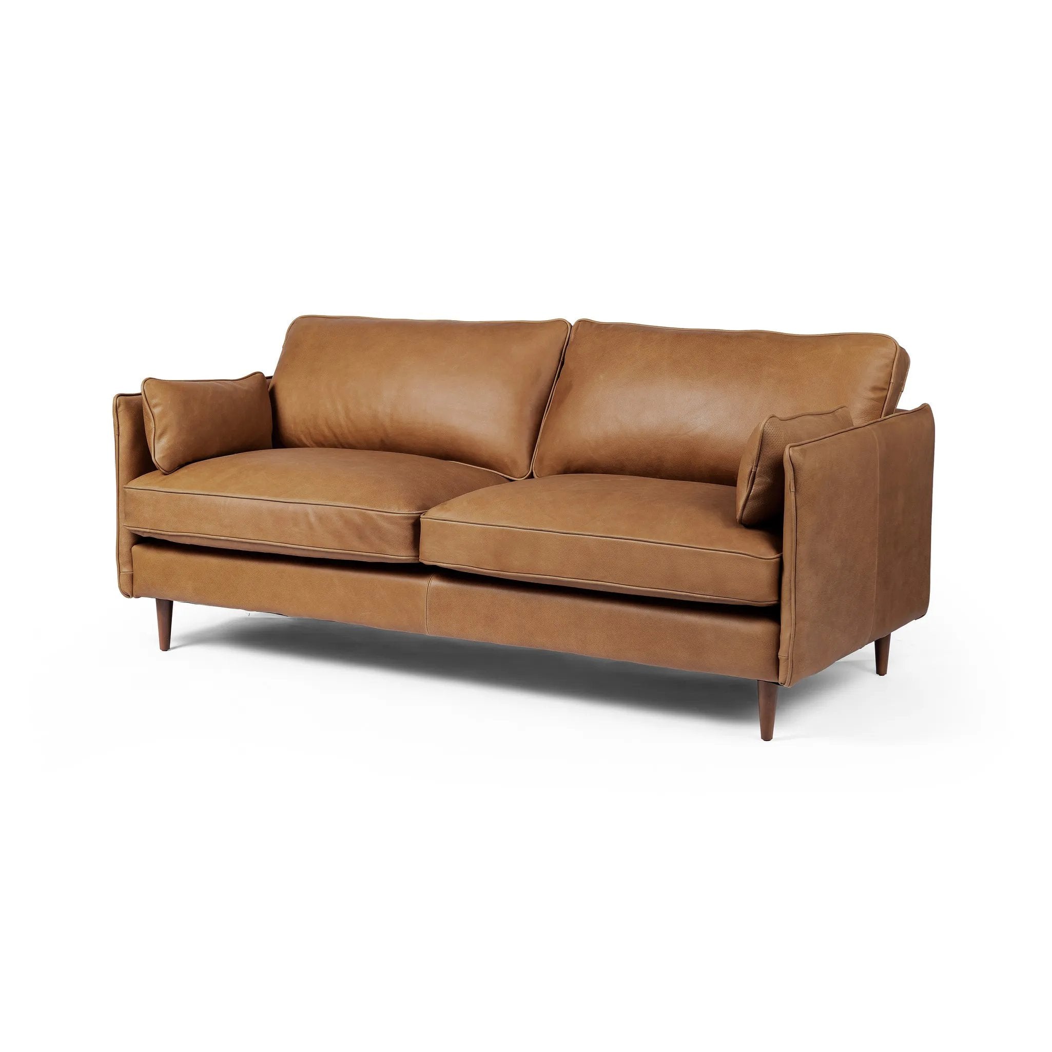 Effortlessly on-trend. Two-cushion seating of top-grain leather, with knife-edge pillows and welted track arms. Almond-finished legs taper for a modern touch atop midcentury influence Amethyst Home provides interior design, new home construction design consulting, vintage area rugs, and lighting in the Nashville metro area.