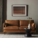 Featuring Reese Palermo Cognac Sofa by Four Hands at Amethyst Home. Effortlessly on-trend. Two-cushion seating of top-grain leather, with knife-edge pillows and welted track arms. Almond-finished legs taper for a modern touch atop midcentury influence.Overall Dimensions: 76.00"w x 35.00"d x 32.75"hWeight : 110.89 lbsMaterials: Top Grain Leather, Poplar Plywo. Amethyst Home provides interior design, new home construction design consulting, vintage area rugs, and lighting in the Portland metro area.