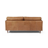 Featuring Reese Palermo Cognac Sofa by Four Hands at Amethyst Home. Effortlessly on-trend. Two-cushion seating of top-grain leather, with knife-edge pillows and welted track arms. Almond-finished legs taper for a modern touch atop midcentury influence.Overall Dimensions: 76.00"w x 35.00"d x 32.75"hWeight : 110.89 lbsMaterials: Top Grain Leather, Poplar Ply. Amethyst Home provides interior design, new home construction design consulting, vintage area rugs, and lighting in the Washington metro area.