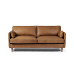 Featuring Reese Palermo Cognac Sofa by Four Hands at Amethyst Home. Effortlessly on-trend. Two-cushion seating of top-grain leather, with knife-edge pillows and welted track arms. Almond-finished legs taper for a modern touch atop midcentury influence.Overall Dimensions: 76.00"w x 35.00"d x 32.75"hWeight : 110.89 lbsMaterials: Top Grain Leather, Poplar . Amethyst Home provides interior design, new home construction design consulting, vintage area rugs, and lighting in the Winter Garden metro area.