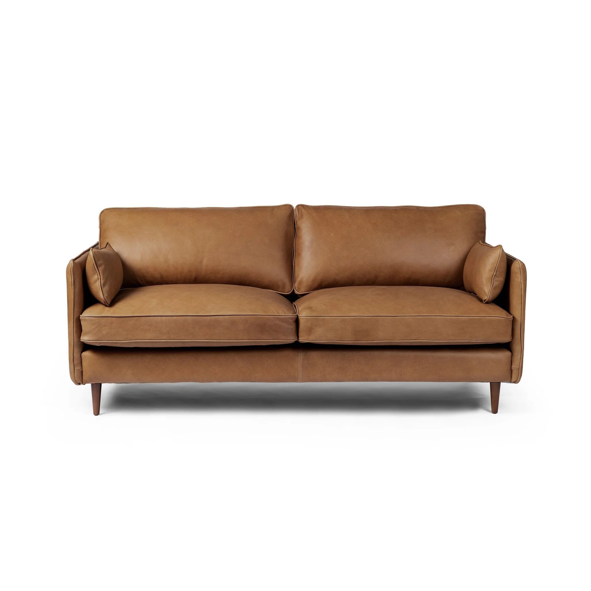 Effortlessly on-trend. Two-cushion seating of top-grain leather, with knife-edge pillows and welted track arms. Almond-finished legs taper for a modern touch atop midcentury influence Amethyst Home provides interior design, new home construction design consulting, vintage area rugs, and lighting in the Winter Garden metro area.