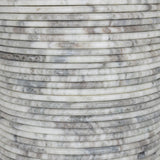 A bold, sculptural presence with movement throughout. This solid marble table features a stacked fluted base and bullnose-edged top that combine to let the natural variation of the material take center stage.As fans of clean design at Amethyst, we love the nature inspired Reeves Dining Table - River Grey Marble. Amethyst Home provides interior design, new home construction design consulting, vintage area rugs, and lighting in the Austin metro area.