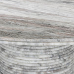 A bold, sculptural presence with movement throughout. This solid marble table features a stacked fluted base and bullnose-edged top that combine to let the natural variation of the material take center stage.As fans of clean design at Amethyst, we love the nature inspired Reeves Dining Table - River Grey Marble. Amethyst Home provides interior design, new home construction design consulting, vintage area rugs, and lighting in the Des Moines metro area.