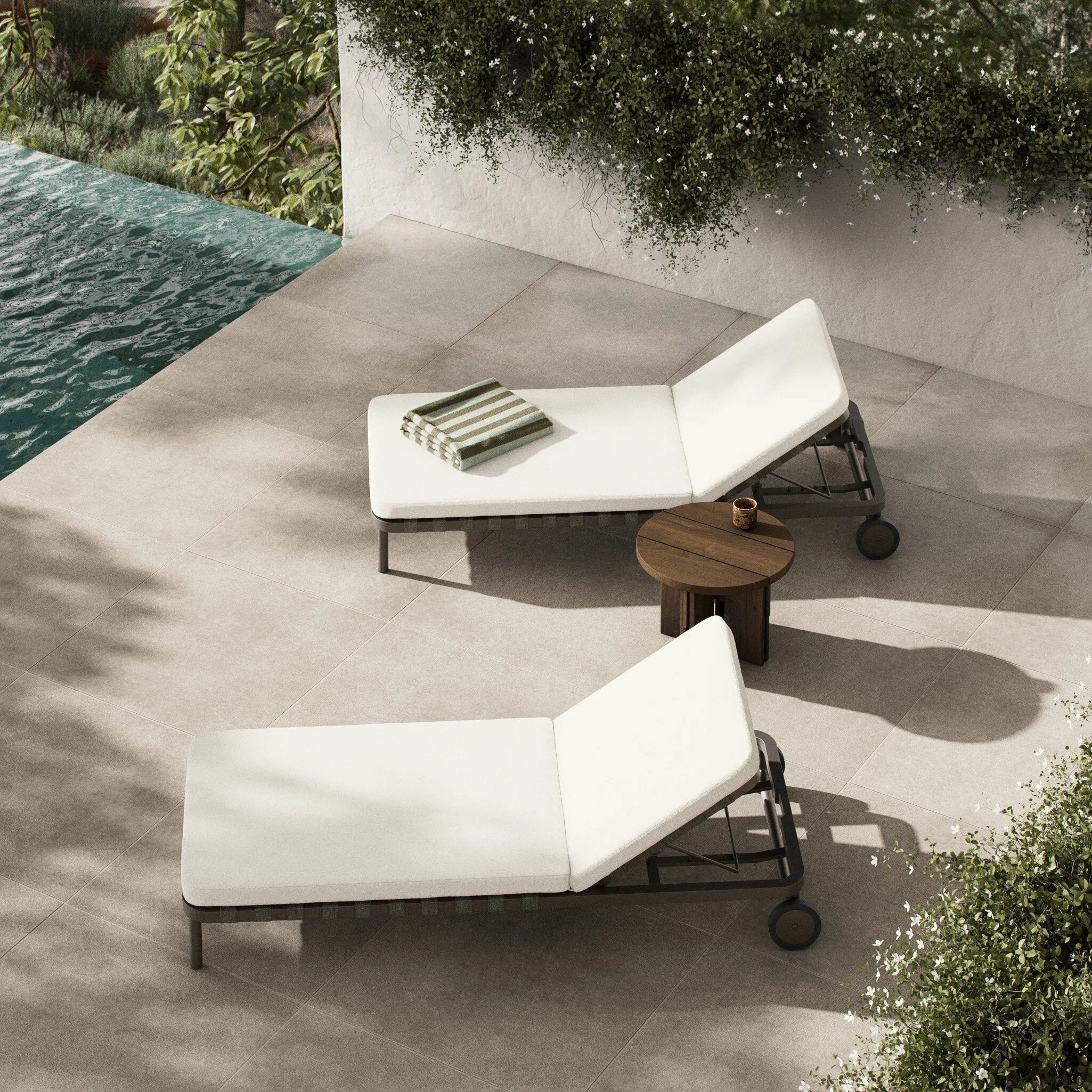 A campaign-inspired outdoor chaise transforms any space into your personal retreat. Monochromatic strap detailing wraps a sleek, minimalist frame, with a linen-like cushion upholstered in high-performance Italian fabric. Designed to elevate your outdoor space with a resort-like ease. Amethyst Home provides interior design, new home construction design consulting, vintage area rugs, and lighting in the Alpharetta metro area.