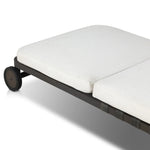 A campaign-inspired outdoor chaise transforms any space into your personal retreat. Monochromatic strap detailing wraps a sleek, minimalist frame, with a linen-like cushion upholstered in high-performance Italian fabric. Designed to elevate your outdoor space with a resort-like ease. Amethyst Home provides interior design, new home construction design consulting, vintage area rugs, and lighting in the Charlotte metro area.