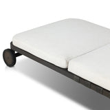 A campaign-inspired outdoor chaise transforms any space into your personal retreat. Monochromatic strap detailing wraps a sleek, minimalist frame, with a linen-like cushion upholstered in high-performance Italian fabric. Designed to elevate your outdoor space with a resort-like ease. Amethyst Home provides interior design, new home construction design consulting, vintage area rugs, and lighting in the Charlotte metro area.
