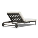 A campaign-inspired outdoor chaise transforms any space into your personal retreat. Monochromatic strap detailing wraps a sleek, minimalist frame, with a linen-like cushion upholstered in high-performance Italian fabric. Designed to elevate your outdoor space with a resort-like ease. Amethyst Home provides interior design, new home construction design consulting, vintage area rugs, and lighting in the Kansas City metro area.