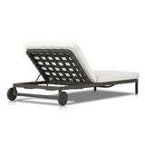 A campaign-inspired outdoor chaise transforms any space into your personal retreat. Monochromatic strap detailing wraps a sleek, minimalist frame, with a linen-like cushion upholstered in high-performance Italian fabric. Designed to elevate your outdoor space with a resort-like ease. Amethyst Home provides interior design, new home construction design consulting, vintage area rugs, and lighting in the Kansas City metro area.