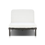A campaign-inspired outdoor chaise transforms any space into your personal retreat. Monochromatic strap detailing wraps a sleek, minimalist frame, with a linen-like cushion upholstered in high-performance Italian fabric. Designed to elevate your outdoor space with a resort-like ease. Amethyst Home provides interior design, new home construction design consulting, vintage area rugs, and lighting in the San Diego metro area.