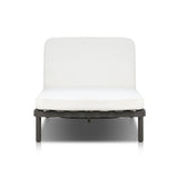 A campaign-inspired outdoor chaise transforms any space into your personal retreat. Monochromatic strap detailing wraps a sleek, minimalist frame, with a linen-like cushion upholstered in high-performance Italian fabric. Designed to elevate your outdoor space with a resort-like ease. Amethyst Home provides interior design, new home construction design consulting, vintage area rugs, and lighting in the San Diego metro area.