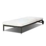 A campaign-inspired outdoor chaise transforms any space into your personal retreat. Monochromatic strap detailing wraps a sleek, minimalist frame, with a linen-like cushion upholstered in high-performance Italian fabric. Designed to elevate your outdoor space with a resort-like ease. Amethyst Home provides interior design, new home construction design consulting, vintage area rugs, and lighting in the Winter Garden metro area.