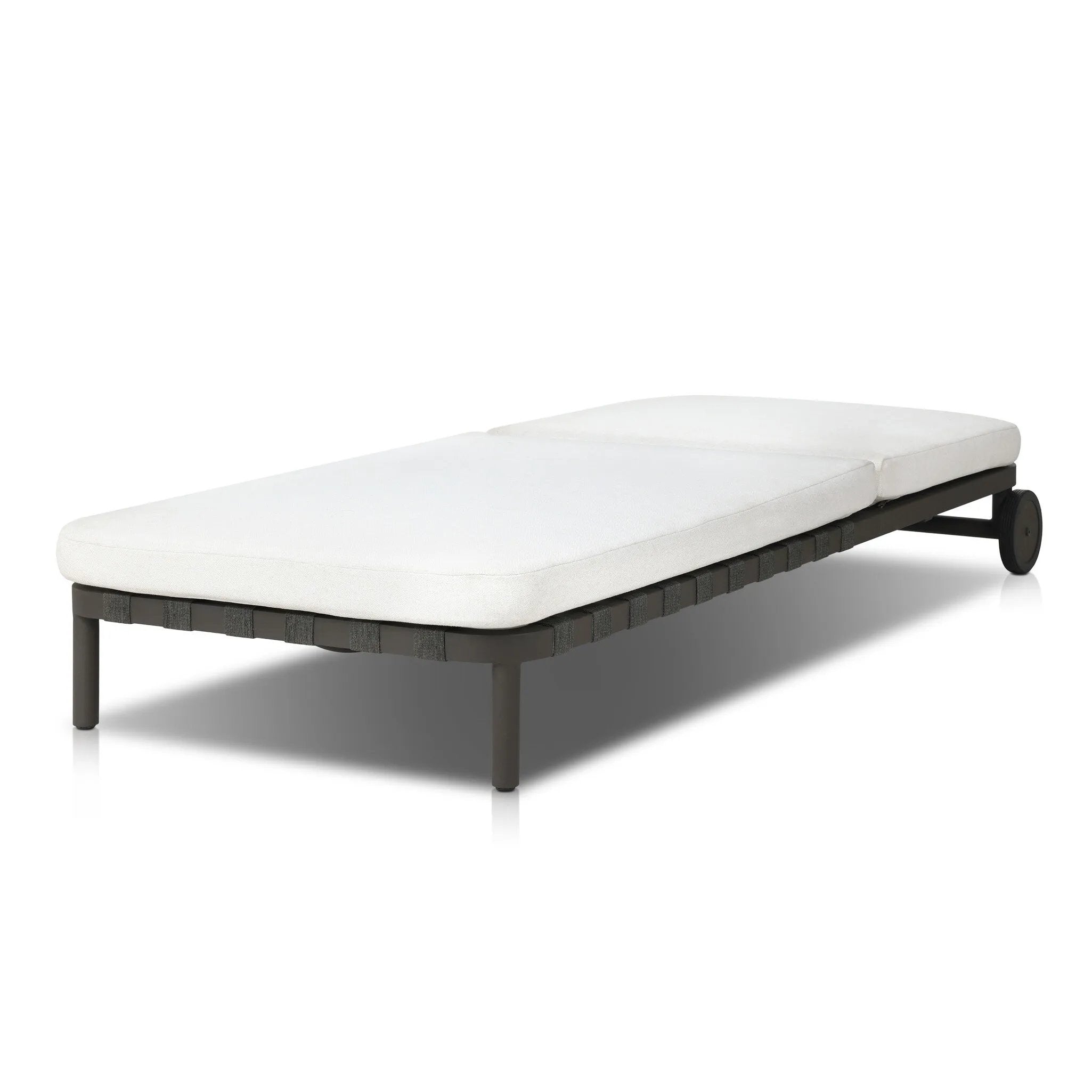 A campaign-inspired outdoor chaise transforms any space into your personal retreat. Monochromatic strap detailing wraps a sleek, minimalist frame, with a linen-like cushion upholstered in high-performance Italian fabric. Designed to elevate your outdoor space with a resort-like ease. Amethyst Home provides interior design, new home construction design consulting, vintage area rugs, and lighting in the Winter Garden metro area.