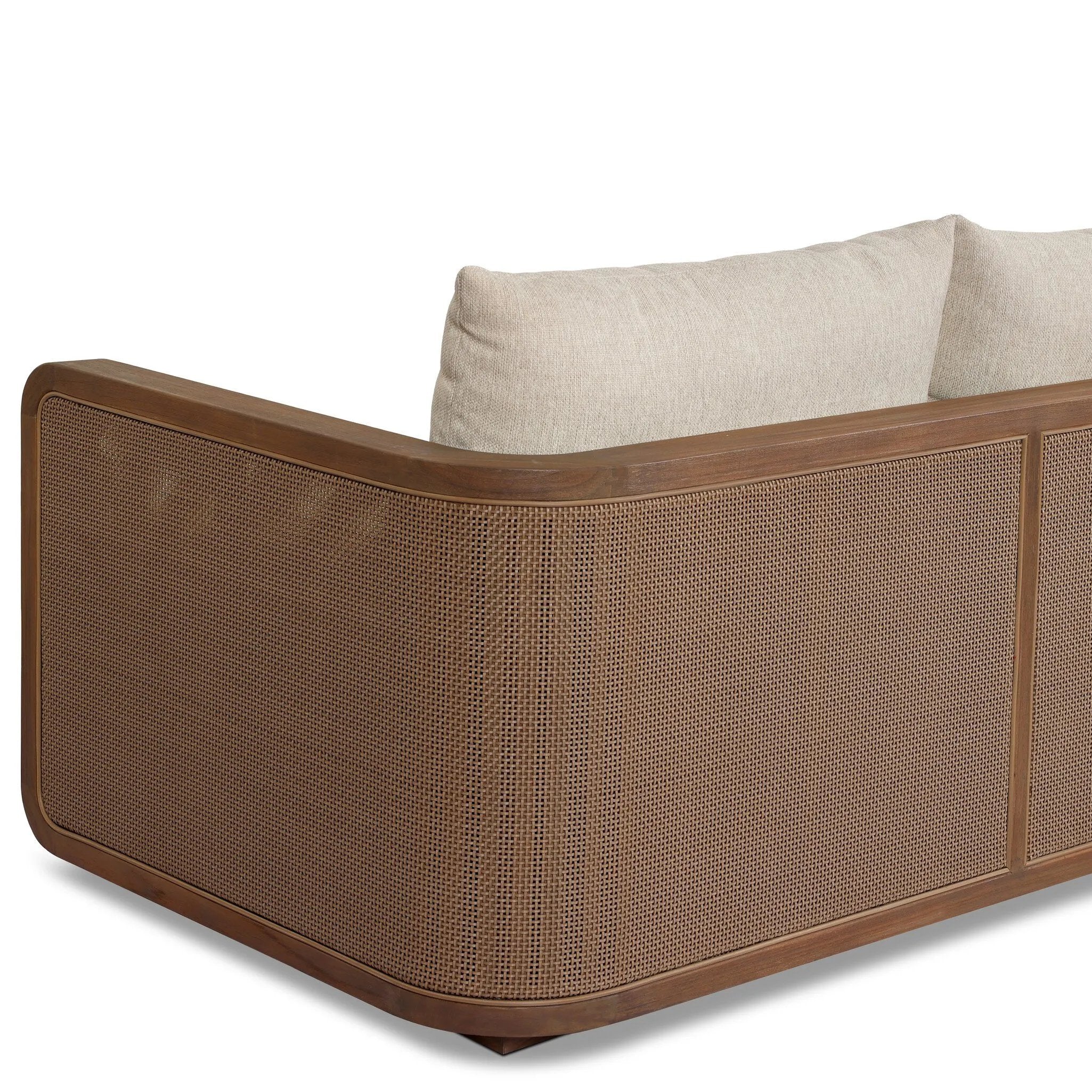 Softness is the story of this mixed material outdoor sofa. With thick, sink-in cushioning and loose pillows on the seatback, the silhouette comes together with a barrel-shaped, FSC®-certified teak frame featuring a crosshatch cane panel. Cover or store inside during inclement weather and when not in use. Amethyst Home provides interior design, new home construction design consulting, vintage area rugs, and lighting in the Park City metro area.