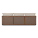 Softness is the story of this mixed material outdoor sofa. With thick, sink-in cushioning and loose pillows on the seatback, the silhouette comes together with a barrel-shaped, FSC®-certified teak frame featuring a crosshatch cane panel. Cover or store inside during inclement weather and when not in use. Amethyst Home provides interior design, new home construction design consulting, vintage area rugs, and lighting in the San Diego metro area.