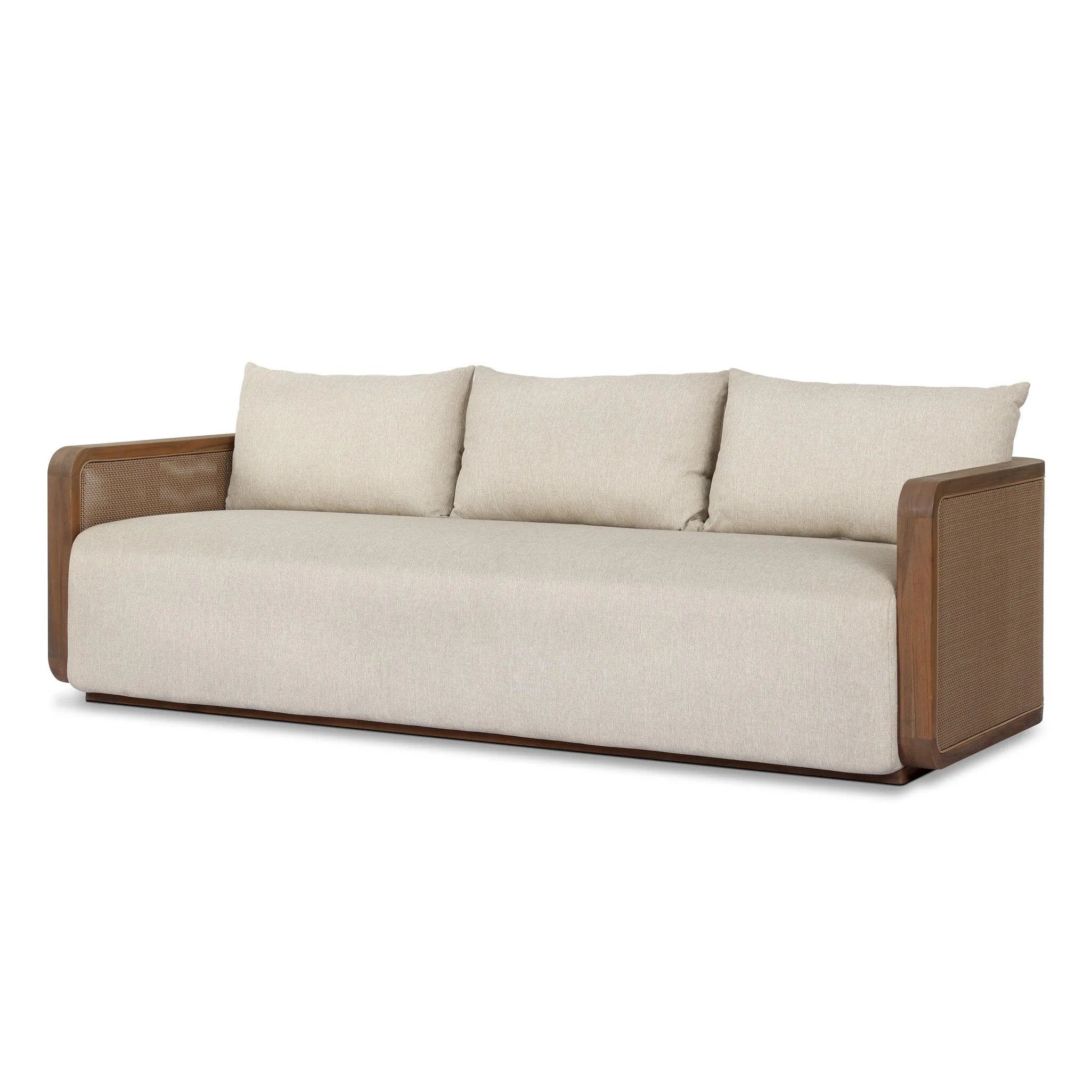 Softness is the story of this mixed material outdoor sofa. With thick, sink-in cushioning and loose pillows on the seatback, the silhouette comes together with a barrel-shaped, FSC®-certified teak frame featuring a crosshatch cane panel. Cover or store inside during inclement weather and when not in use. Amethyst Home provides interior design, new home construction design consulting, vintage area rugs, and lighting in the Tampa metro area.