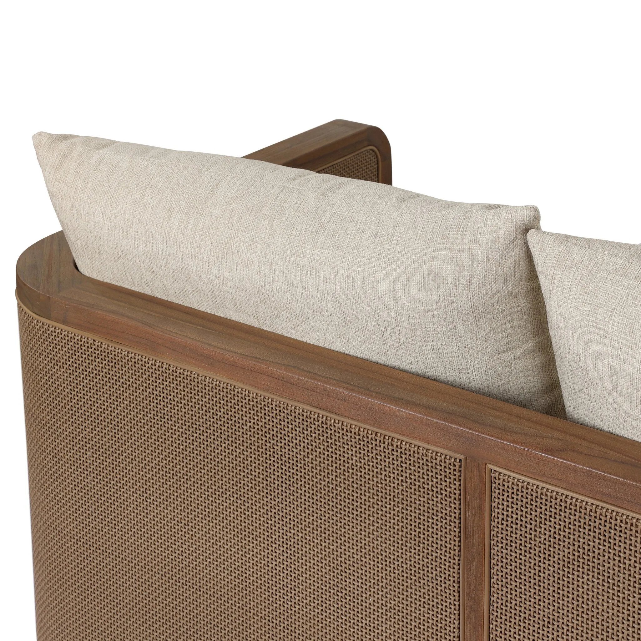Softness is the story of this mixed material outdoor sofa. With thick, sink-in cushioning and loose pillows on the seatback, the silhouette comes together with a barrel-shaped, FSC®-certified teak frame featuring a crosshatch cane panel. Cover or store inside during inclement weather and when not in use. Amethyst Home provides interior design, new home construction design consulting, vintage area rugs, and lighting in the Washington metro area.
