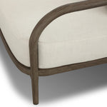 Capturing the ease of tropical ratan seating, an oversized outdoor chair is shaped from FSC-certified teak and wrapped with rush cord detailing. Exemplary woodworking is seen in the fluid lines that end with sturdy spindle legs supporting the comfortable S-spring fixed seat and loose cushion, upholstered in taupe burlap fabric. Amethyst Home provides interior design, new home construction design consulting, vintage area rugs, and lighting in the Laguna Beach metro area.