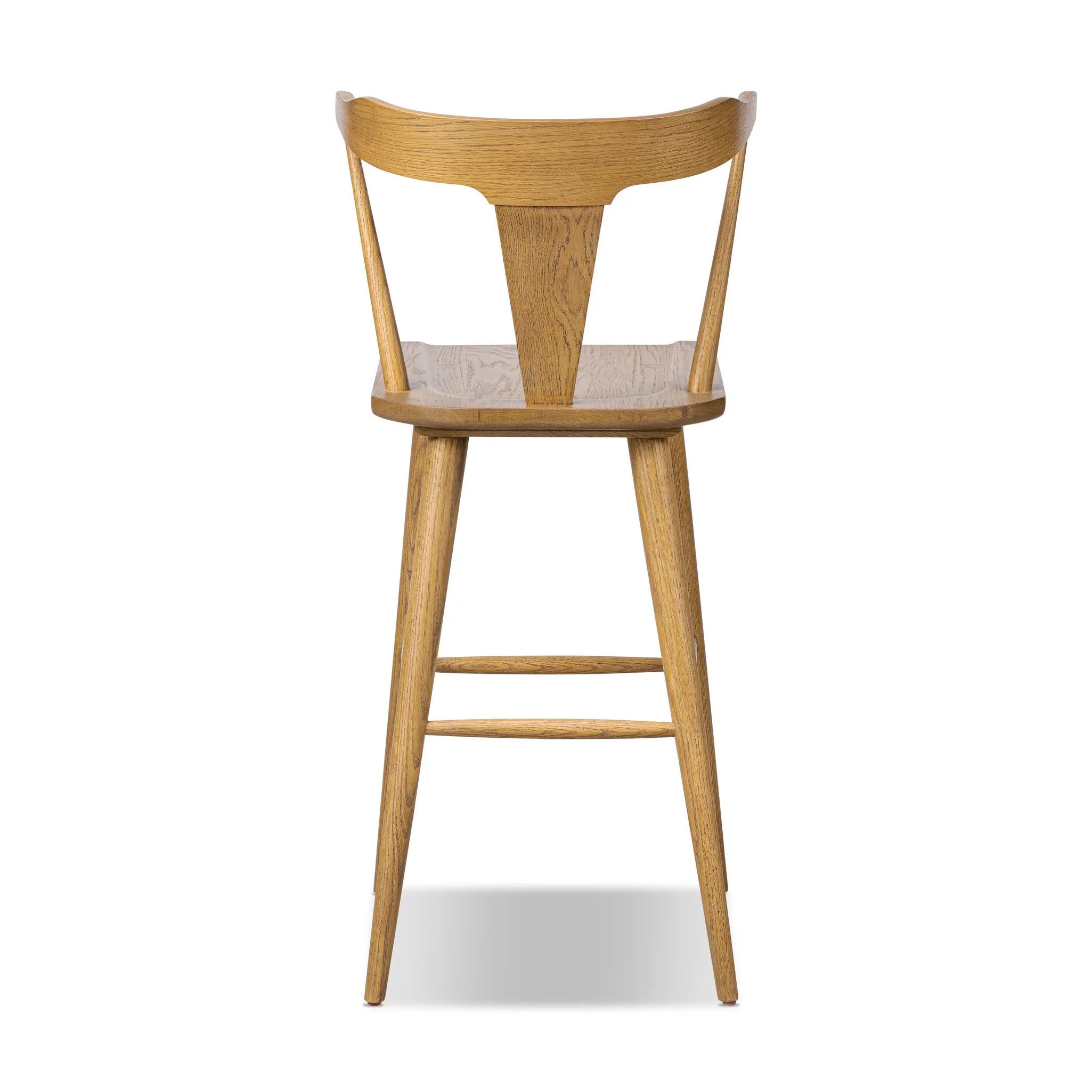 Featuring Ripley Sandy Oak Bar + Counter Stool by Four Hands at Amethyst Home. A fresh, bar-style take on mid-century Windsor seating, featuring a bowed, sculptural silhouette and soft black finish to highlight the natural grain of weathered oak.Bar StoolOverall Dimensions: 20.50"w x 20.50"d x 42.50"hWeight: 17.64 lbsCounter StoolOverall Dimensions: 20.50". Amethyst Home provides interior design, new home construction design consulting, vintage area rugs, and lighting in the Scottsdale metro area.