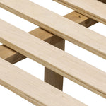 Rounded, chunky dowel legs in an amber oak finish frame the tan top-grain leather headboard of this simple-but-striking bed frame Amethyst Home provides interior design, new home construction design consulting, vintage area rugs, and lighting in the Dallas metro area.