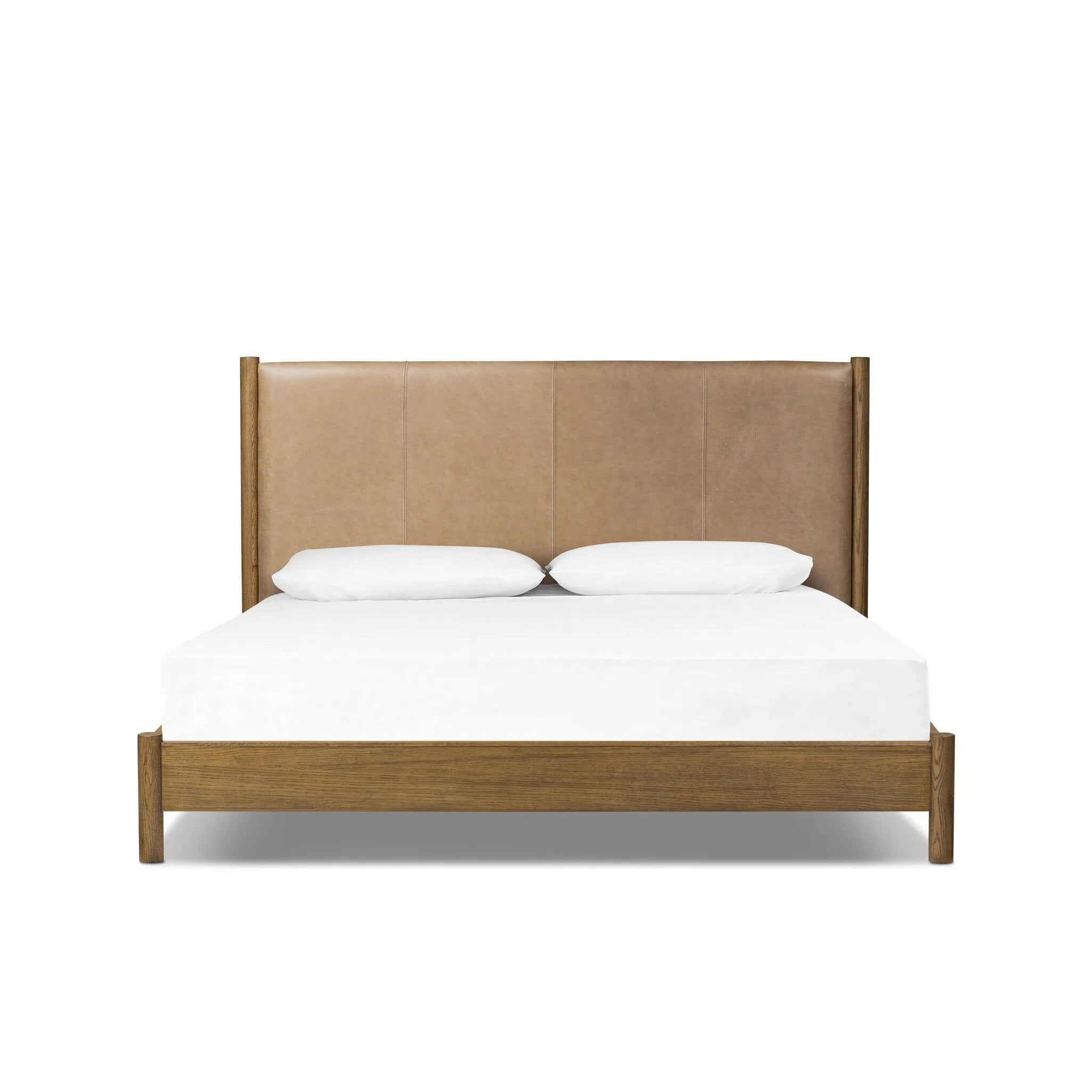 Rounded, chunky dowel legs in an amber oak finish frame the tan top-grain leather headboard of this simple-but-striking bed frame Amethyst Home provides interior design, new home construction design consulting, vintage area rugs, and lighting in the Laguna Beach metro area.