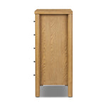 Create storage space in the bedroom with a five-drawer dresser of amber-finished oak. Chunky dowel legs support a tall silhouette and overhang top, all finished out with simple gunmetal hardware Amethyst Home provides interior design, new home construction design consulting, vintage area rugs, and lighting in the Winter Garden metro area.