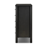 Create storage space in the bedroom with a five-drawer dresser of ebony-finished oak. Chunky dowel legs support a tall silhouette and overhang top, all finished out with simple gunmetal hardware Amethyst Home provides interior design, new home construction design consulting, vintage area rugs, and lighting in the Kansas City metro area.