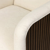 Designed with a shelter-style silhouette, this swivel chair wraps around for a seamless sit. The showstopping wood fluting adds textural contrast and organic appeal to the 360-degree swivel.As fans of clean aesthetics at Amethyst, we love the nature inspired Rory Swivel Chair - Laughlin Bone. Amethyst Home provides interior design, new home construction design consulting, vintage area rugs, and lighting in the Kansas City metro area.