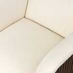 Designed with a shelter-style silhouette, this swivel chair wraps around for a seamless sit. The showstopping wood fluting adds textural contrast and organic appeal to the 360-degree swivel.As fans of clean aesthetics at Amethyst, we love the nature inspired Rory Swivel Chair - Laughlin Bone. Amethyst Home provides interior design, new home construction design consulting, vintage area rugs, and lighting in the Newport Beach metro area.