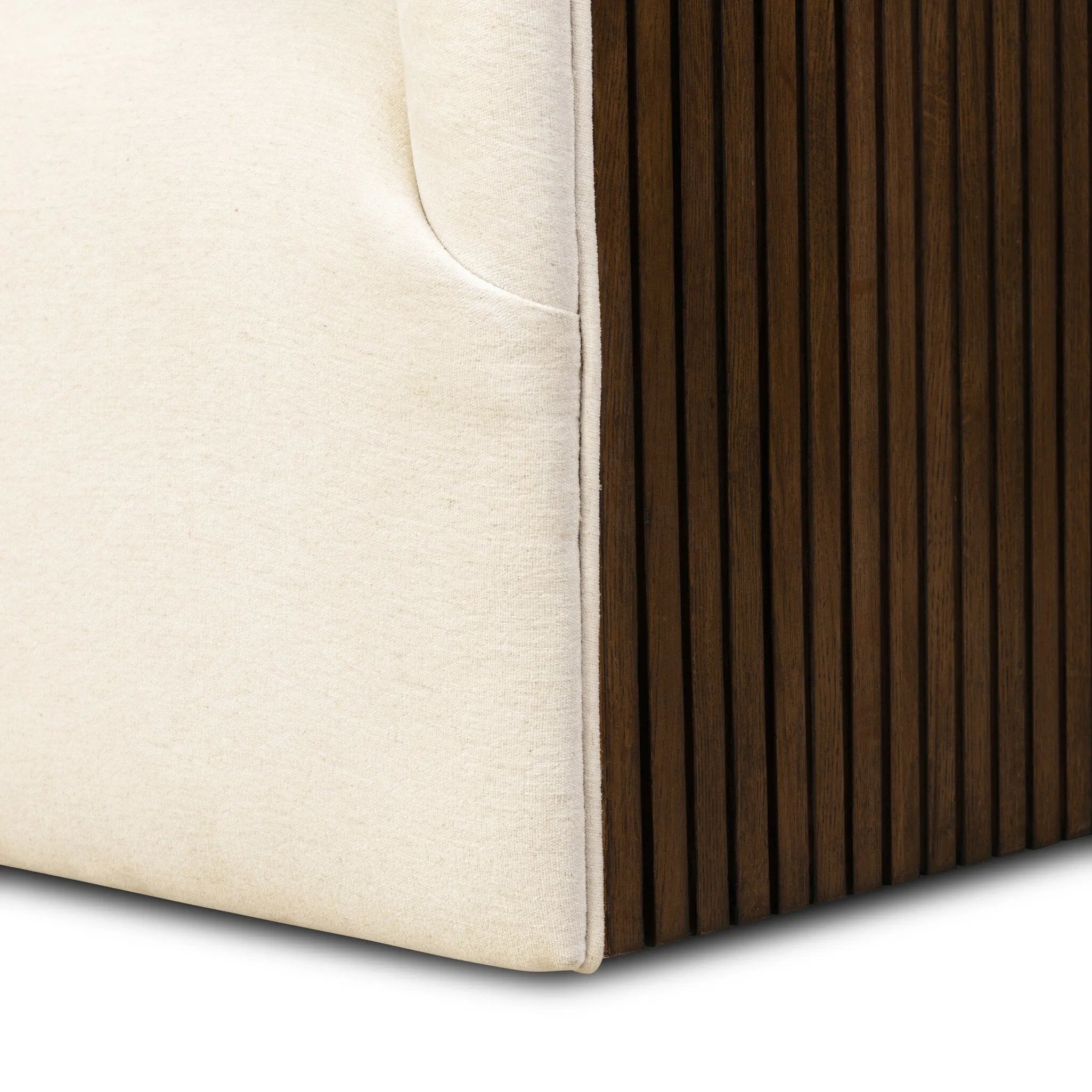 Designed with a shelter-style silhouette, this swivel chair wraps around for a seamless sit. The showstopping wood fluting adds textural contrast and organic appeal to the 360-degree swivel.As fans of clean aesthetics at Amethyst, we love the nature inspired Rory Swivel Chair - Laughlin Bone. Amethyst Home provides interior design, new home construction design consulting, vintage area rugs, and lighting in the Omaha metro area.