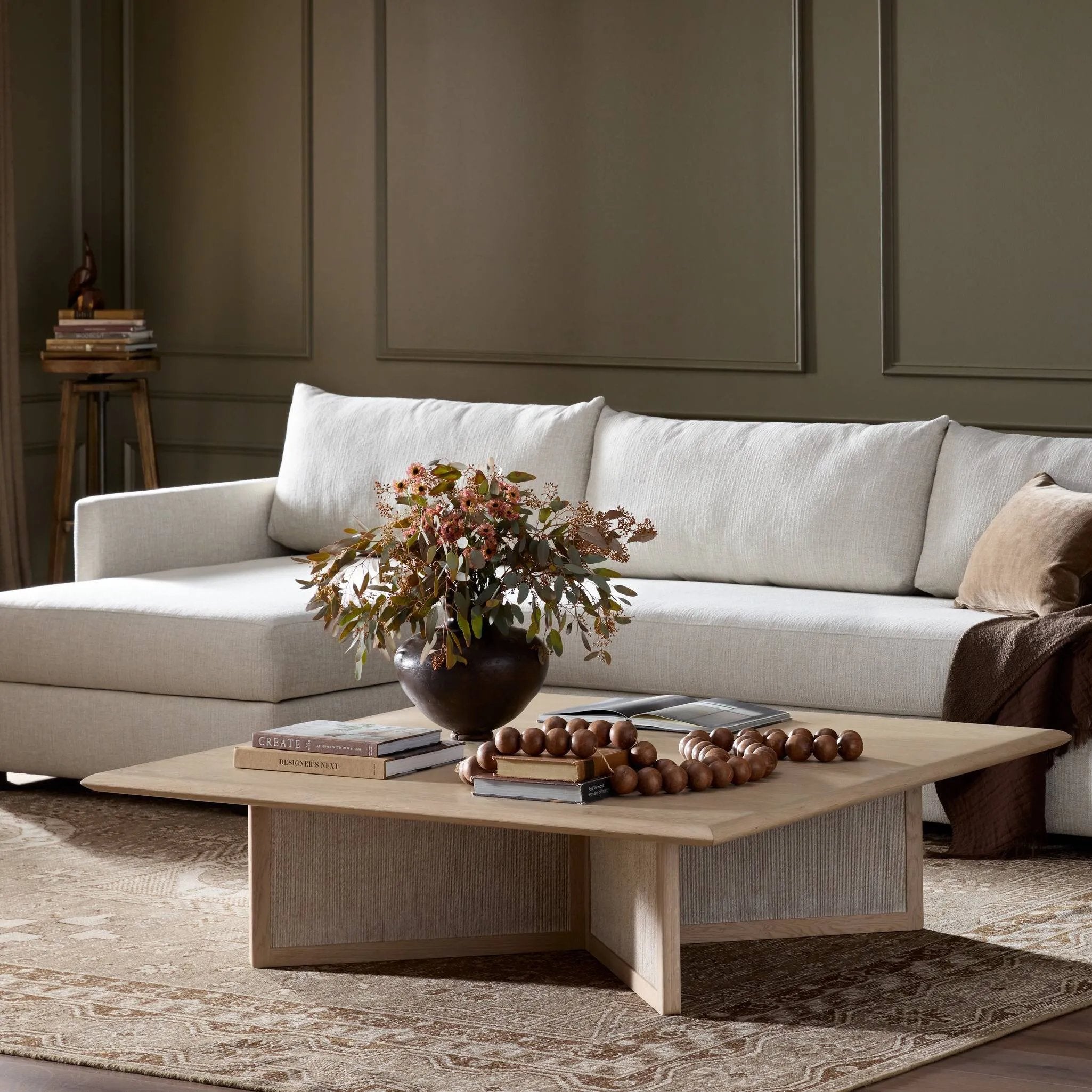 Anchor your living space with a squared coffee table of light, natural oak. A smooth top pairs with a panel-style base of woven paper cord for a clean, Scandinavian-inspired look that will work into your collection beautifully Amethyst Home provides interior design, new home construction design consulting, vintage area rugs, and lighting in the Alpharetta metro area.