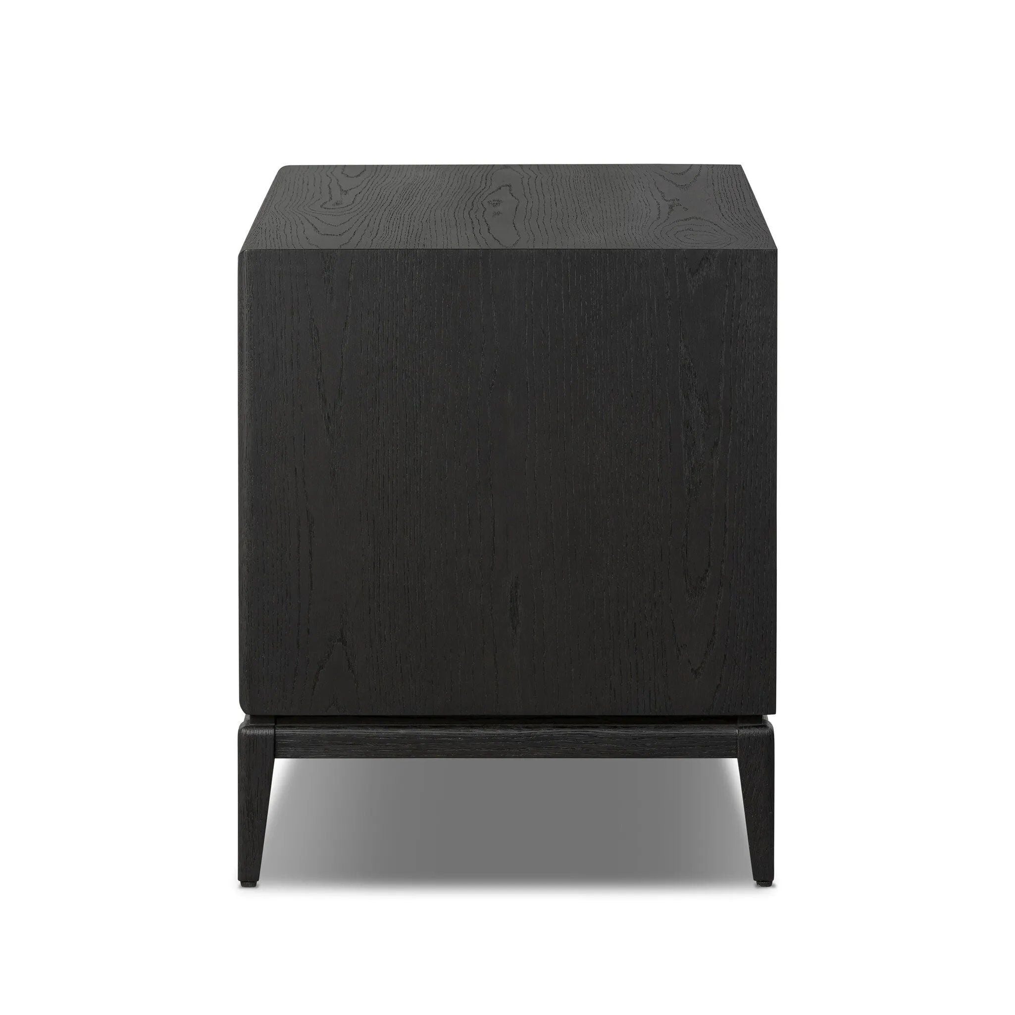 Elevate your bedside storage with a nightstand of black-finished oak. A smooth top pairs with a single drawer front of woven paper cord for a dark, rich look that will work into your bedroom collection beautifully Amethyst Home provides interior design, new home construction design consulting, vintage area rugs, and lighting in the Charlotte metro area.
