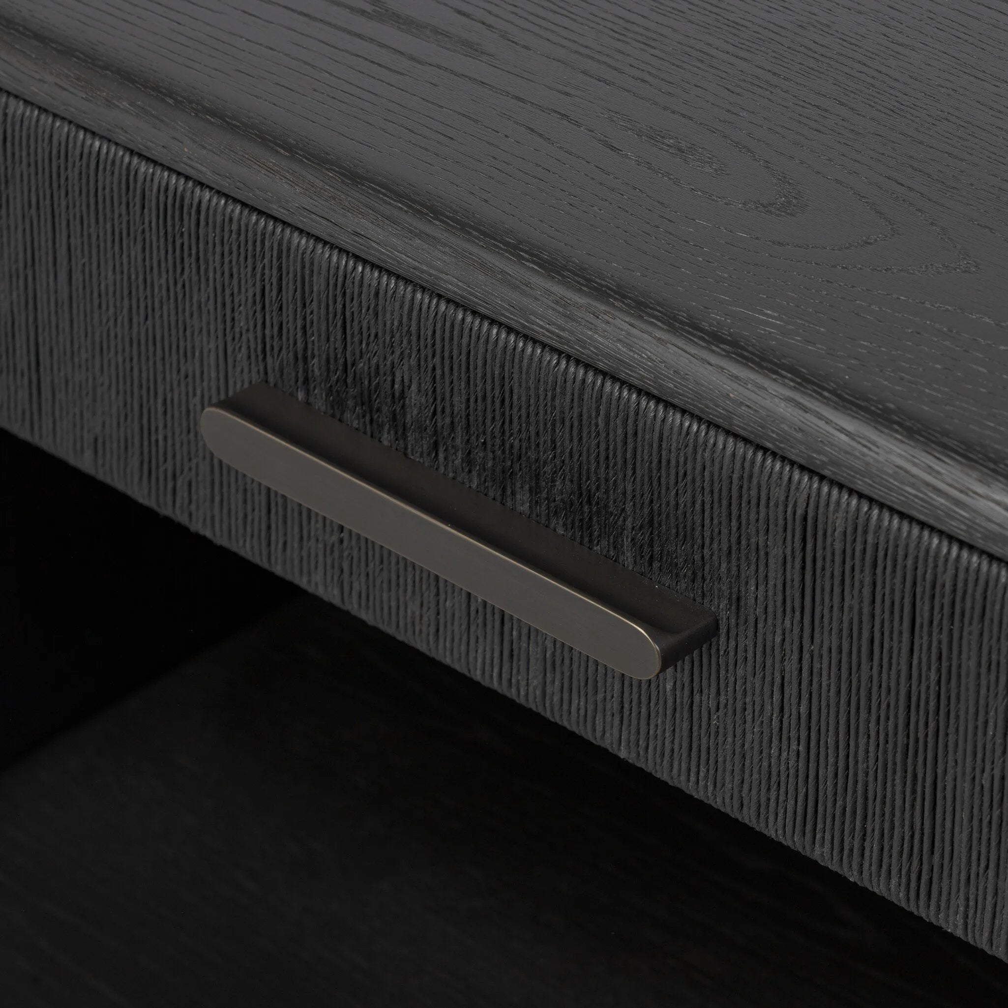 Elevate your bedside storage with a nightstand of black-finished oak. A smooth top pairs with a single drawer front of woven paper cord for a dark, rich look that will work into your bedroom collection beautifully Amethyst Home provides interior design, new home construction design consulting, vintage area rugs, and lighting in the Newport Beach metro area.
