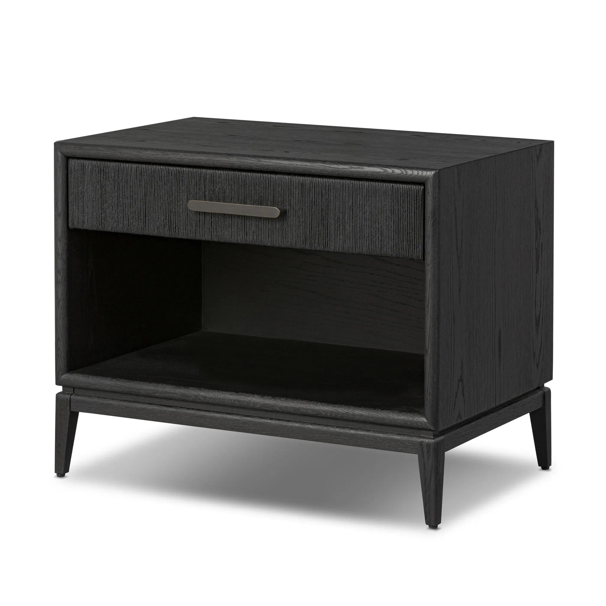 Elevate your bedside storage with a nightstand of black-finished oak. A smooth top pairs with a single drawer front of woven paper cord for a dark, rich look that will work into your bedroom collection beautifully Amethyst Home provides interior design, new home construction design consulting, vintage area rugs, and lighting in the Scottsdale metro area.