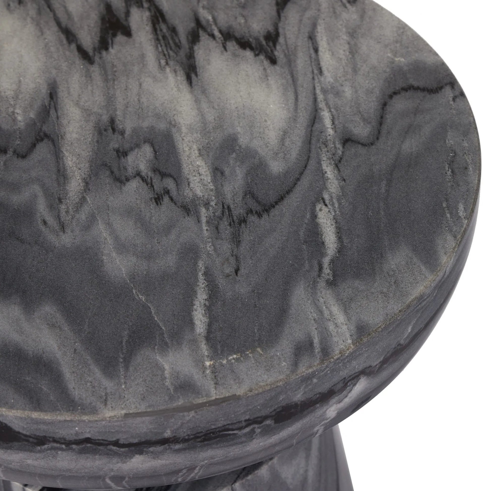 Precise curves add up to modern presence. Bold ebony marble is carved from a single piece of stone and turned on a lathe to form the curves and angles of this end table Amethyst Home provides interior design, new home construction design consulting, vintage area rugs, and lighting in the Des Moines metro area.