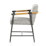 Textural grey seating upholstered in high-performance fabric exclusive to Four Hands, with angular solid oak arms and black-finished stainless steel framing.As lovers of organic modern style at Amethyst, we love the designer inspired Rowen Dining Chair - Thames Raven. Amethyst Home provides interior design, new home construction design consulting, vintage area rugs, and lighting in the Charlotte metro area.