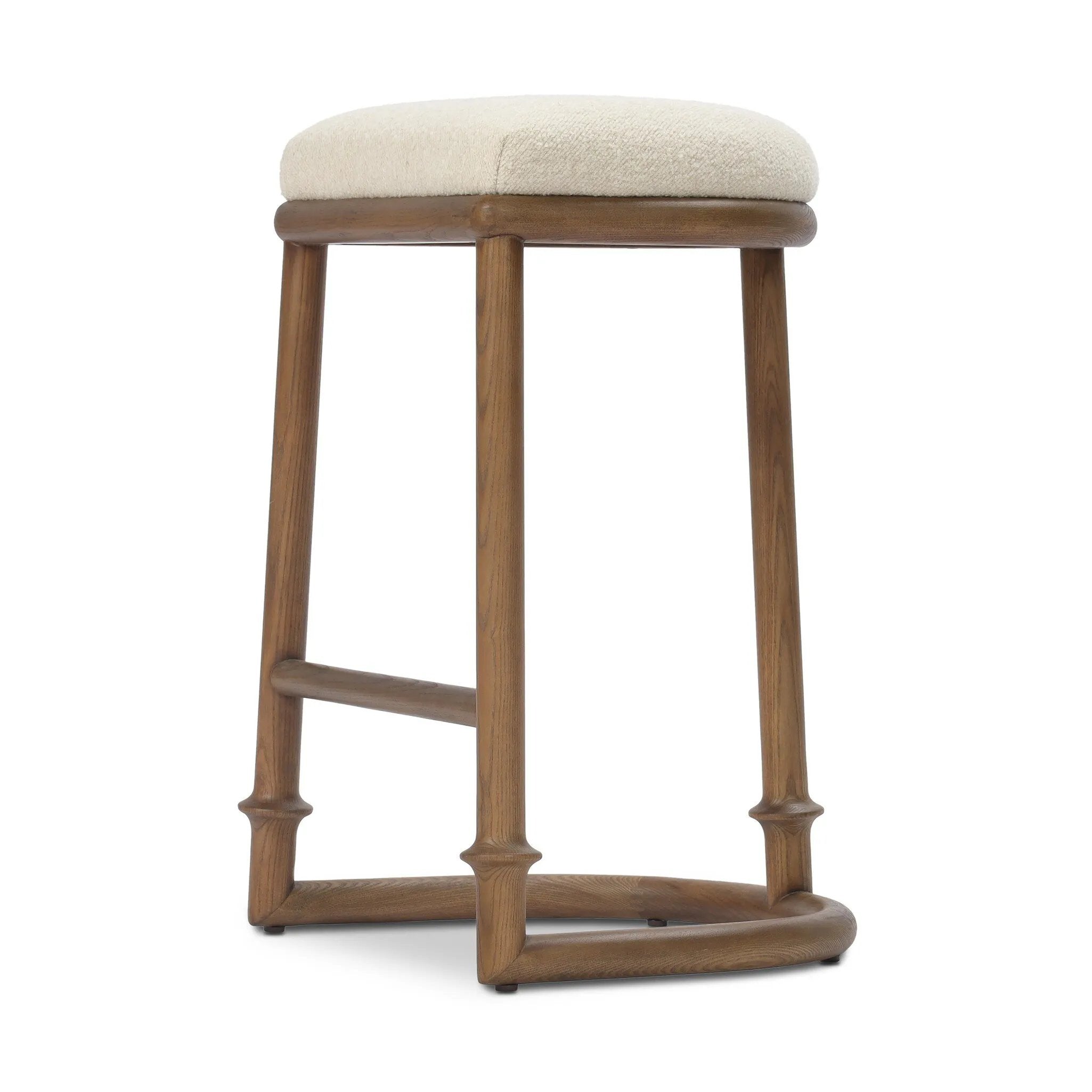 A simple backless stool pairs antique walnut-finished solid ash and high-performance fabric, for a warm, light look. A backless cylinder frame featured tapering for extra stability, with disc-like turning at the bottom for a heritage design detail. Perfectly sized for the counter. Amethyst Home provides interior design, new home construction design consulting, vintage area rugs, and lighting in the Salt Lake City metro area.