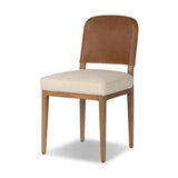 The classic material mix look you want in your dining space. Butterscotch top-grain leather with a subtle vintage look pairs with a neutral performance fabric-upholstered seat. Tapered legs and an armless silhouette look timelessly chic. Amethyst Home provides interior design, new home construction design consulting, vintage area rugs, and lighting in the Boston metro area.