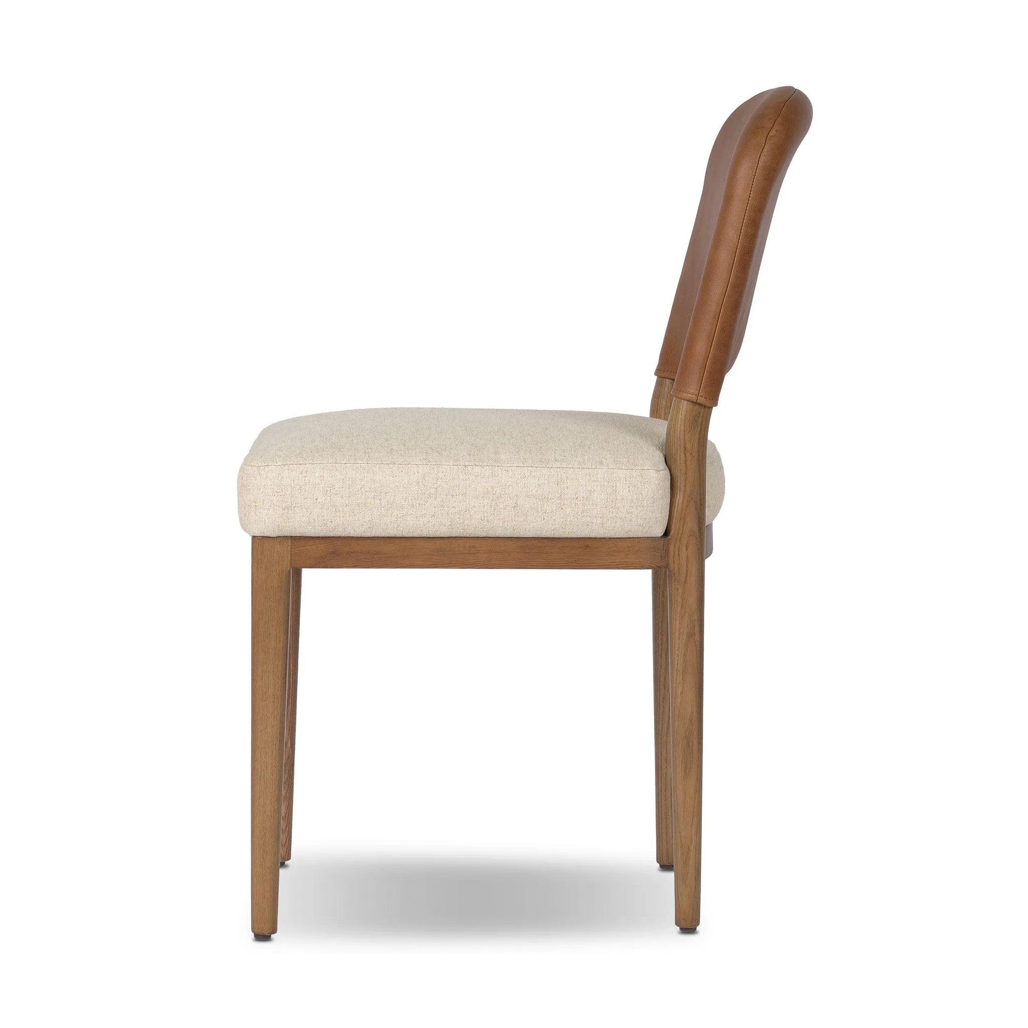 The classic material mix look you want in your dining space. Butterscotch top-grain leather with a subtle vintage look pairs with a neutral performance fabric-upholstered seat. Tapered legs and an armless silhouette look timelessly chic. Amethyst Home provides interior design, new home construction design consulting, vintage area rugs, and lighting in the Calabasas metro area.