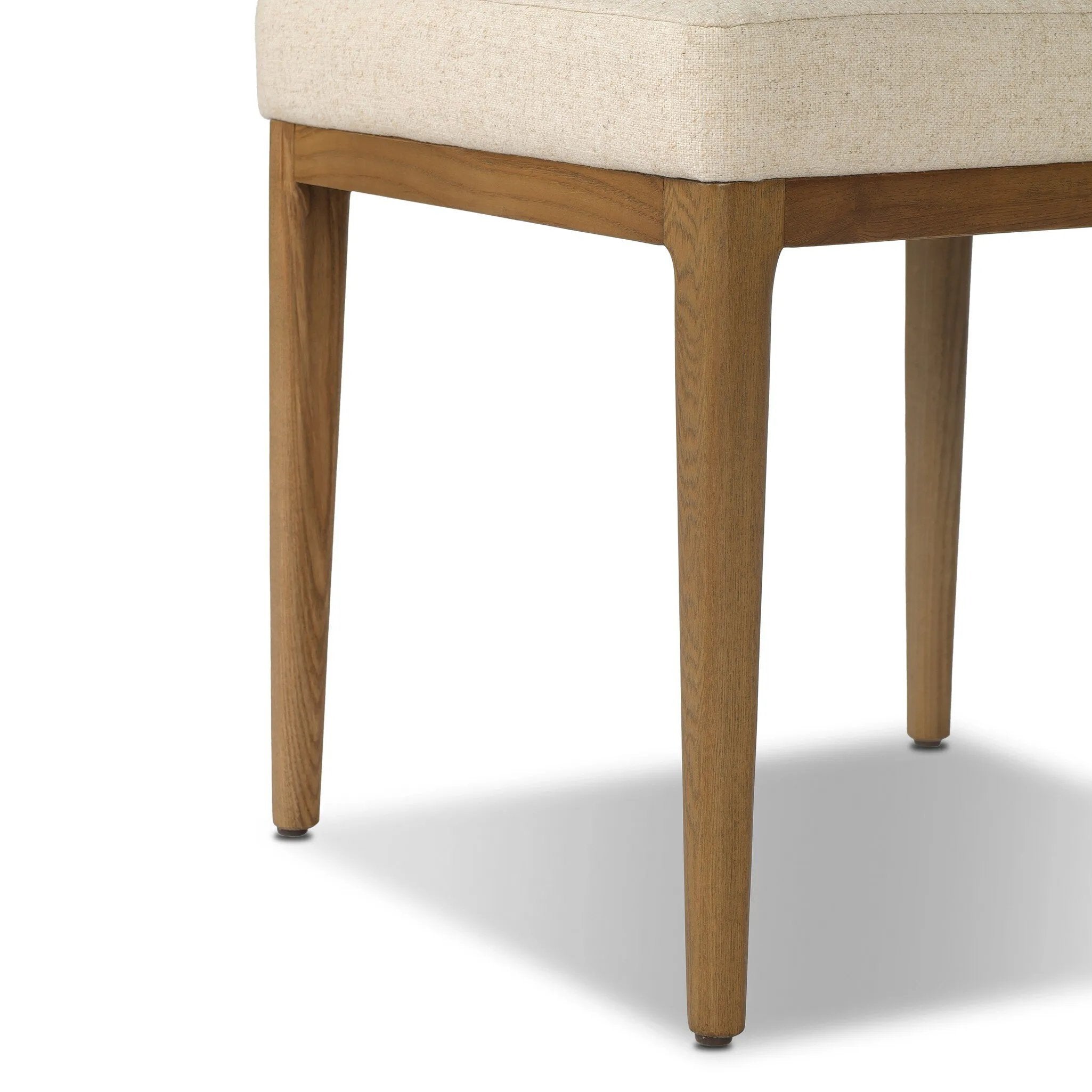 The classic material mix look you want in your dining space. Butterscotch top-grain leather with a subtle vintage look pairs with a neutral performance fabric-upholstered seat. Tapered legs and an armless silhouette look timelessly chic. Amethyst Home provides interior design, new home construction design consulting, vintage area rugs, and lighting in the San Diego metro area.