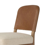 The classic material mix look you want in your dining space. Butterscotch top-grain leather with a subtle vintage look pairs with a neutral performance fabric-upholstered seat. Tapered legs and an armless silhouette look timelessly chic. Amethyst Home provides interior design, new home construction design consulting, vintage area rugs, and lighting in the Washington metro area.