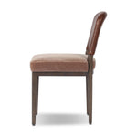 A moody, mixed material look that stands out. A velvety, wool-blend seat and top-grain leather, seat back are framed by solid