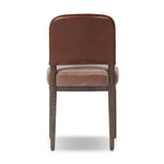 A moody, mixed material look that stands out. A velvety, wool-blend seat and top-grain leather, seat back are framed by solid
