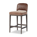 A moody, mixed material stool that stands out. A velvety, wool-blend seat and top-grain leather, seat back are framed by solid ash. Perfectly sized for the counter.As fans of organic modern aesthetics at Amethyst, we love the designer inspired Ryver Stool. Amethyst Home provides interior design, new home construction design consulting, vintage area rugs, and lighting in the Tampa metro area.