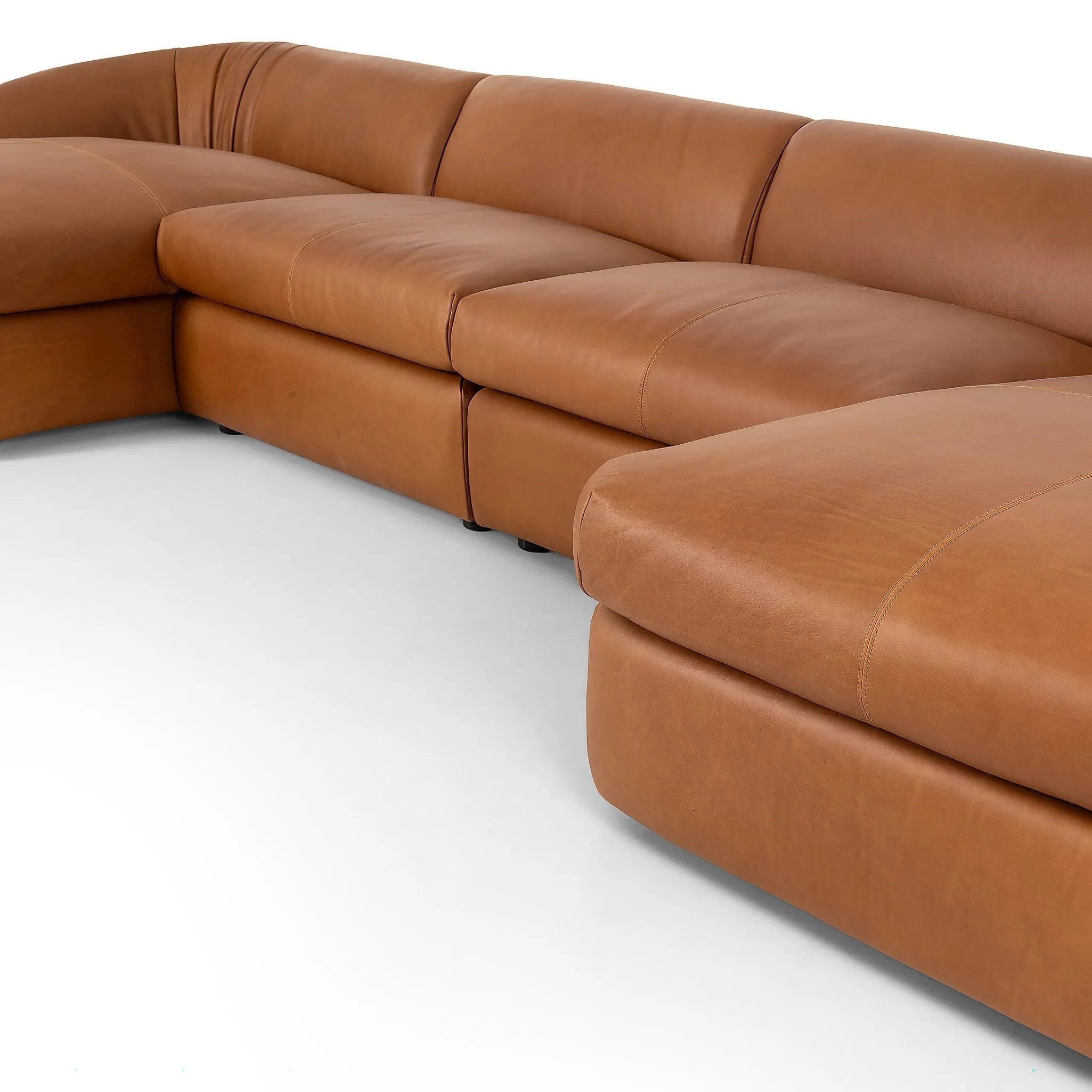 Featuring Saldana Lorento Cognac 4Pc Double Chaise by Four Hands at Amethyst Home. Soft, supple top-grain leather with a warm cognac hue meets vintage vibes with modern comfort. Intricate rouching along the back and corners gives each piece of this four-piece sectional a handcrafted, tailored feel, while feather-wrapped cushioning and spring suspension invite . Amethyst Home provides interior design, new home construction design consulting, vintage area rugs, and lighting in the Austin metro area.