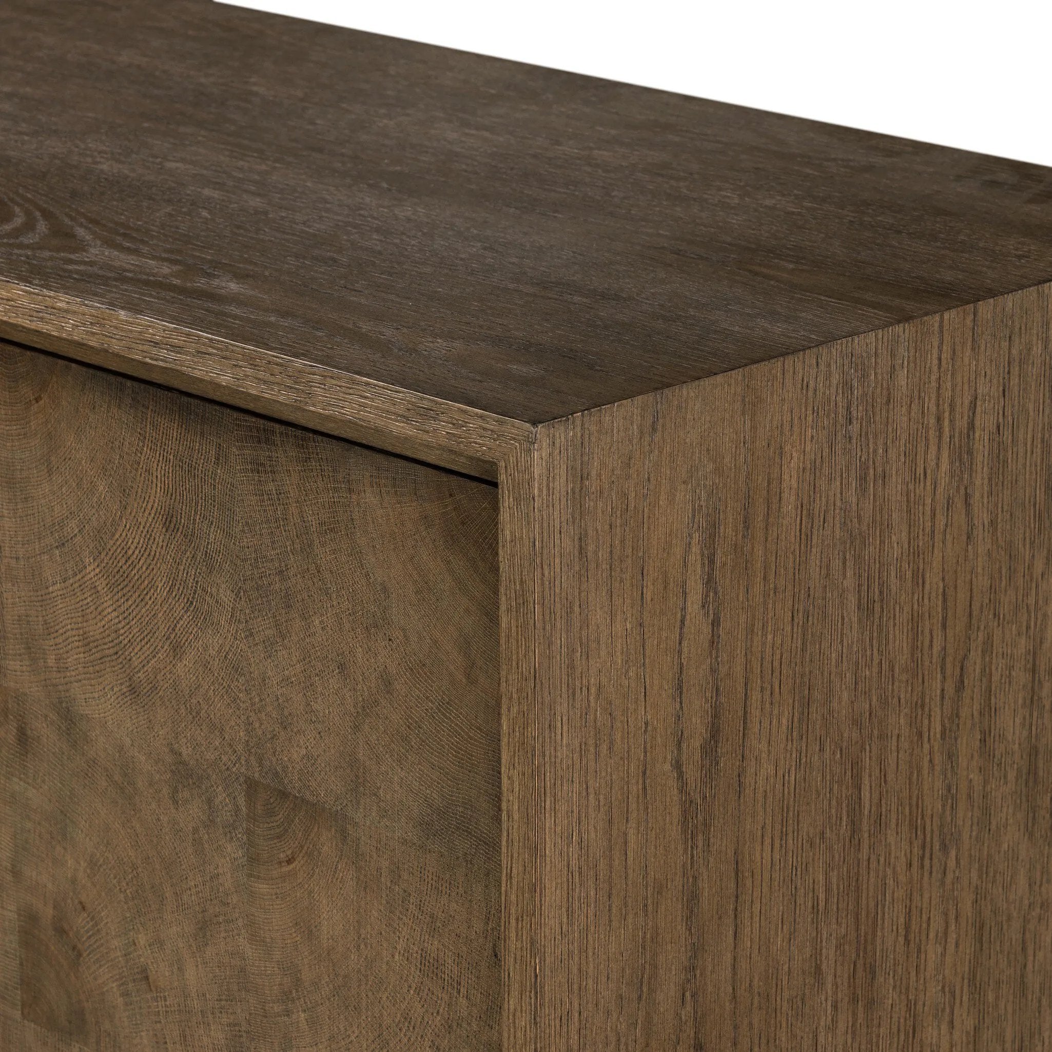 Grounding and stunning. We paired a modern frame and chunky base with door panels featuring oyster cuts of oak that take a specialized skill to create. Each cut captures the story of the wood and brings a natural, organic rhythm to the entire cabinet, and any space. Amethyst Home provides interior design, new home construction design consulting, vintage area rugs, and lighting in the Calabasas metro area.