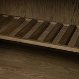 Grounding and stunning. We paired a modern frame and chunky base with door panels featuring oyster cuts of oak that take a specialized skill to create. Each cut captures the story of the wood and brings a natural, organic rhythm to the entire cabinet, and any space. Amethyst Home provides interior design, new home construction design consulting, vintage area rugs, and lighting in the Laguna Beach metro area.