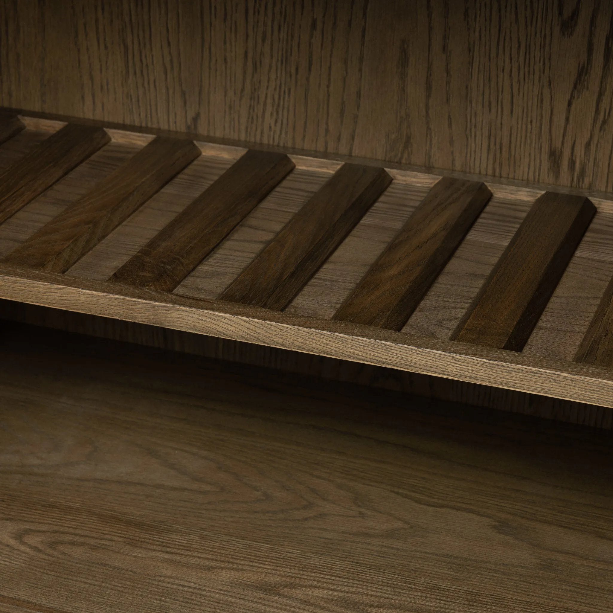 Grounding and stunning. We paired a modern frame and chunky base with door panels featuring oyster cuts of oak that take a specialized skill to create. Each cut captures the story of the wood and brings a natural, organic rhythm to the entire cabinet, and any space. Amethyst Home provides interior design, new home construction design consulting, vintage area rugs, and lighting in the Laguna Beach metro area.