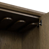 Grounding and stunning. We paired a modern frame and chunky base with door panels featuring oyster cuts of oak that take a specialized skill to create. Each cut captures the story of the wood and brings a natural, organic rhythm to the entire cabinet, and any space. Amethyst Home provides interior design, new home construction design consulting, vintage area rugs, and lighting in the Los Angeles metro area.