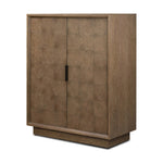 Grounding and stunning. We paired a modern frame and chunky base with door panels featuring oyster cuts of oak that take a specialized skill to create. Each cut captures the story of the wood and brings a natural, organic rhythm to the entire cabinet, and any space. Amethyst Home provides interior design, new home construction design consulting, vintage area rugs, and lighting in the Portland metro area.